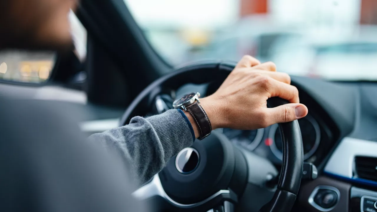 Close up of a male driving