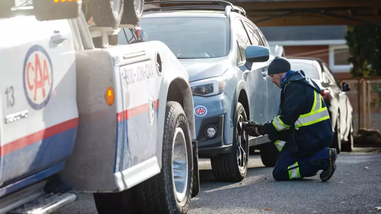 CAA driver providing roadside assistance