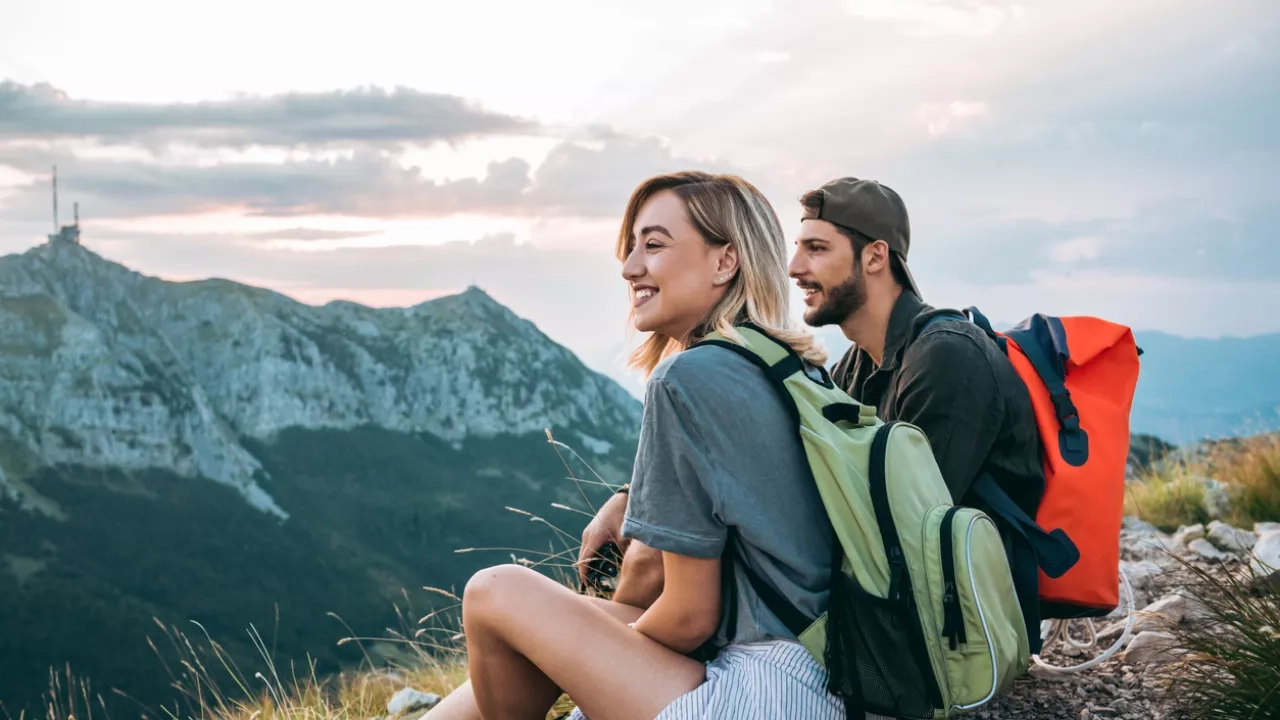 young couple relaxing after hiking