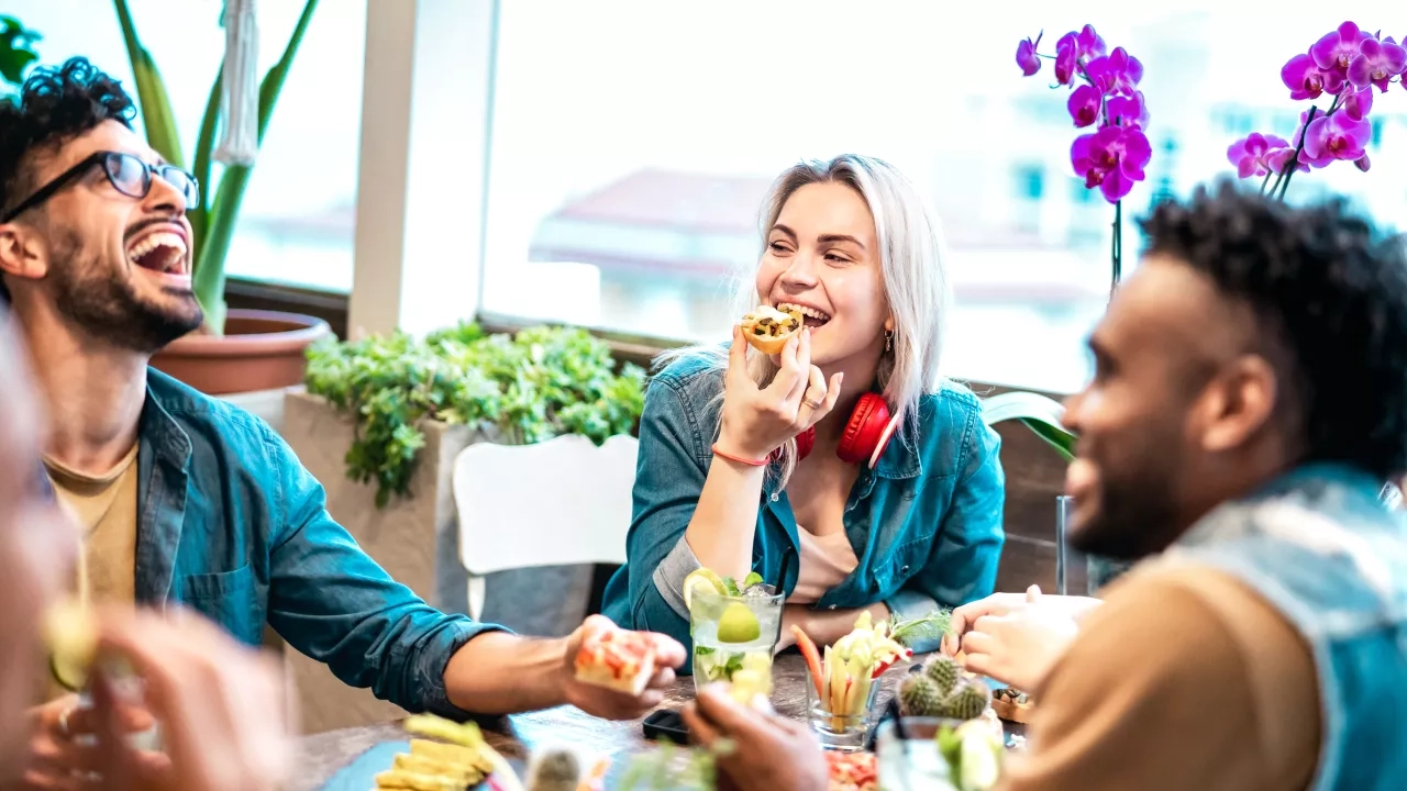 Group of friends eating at a restaurant