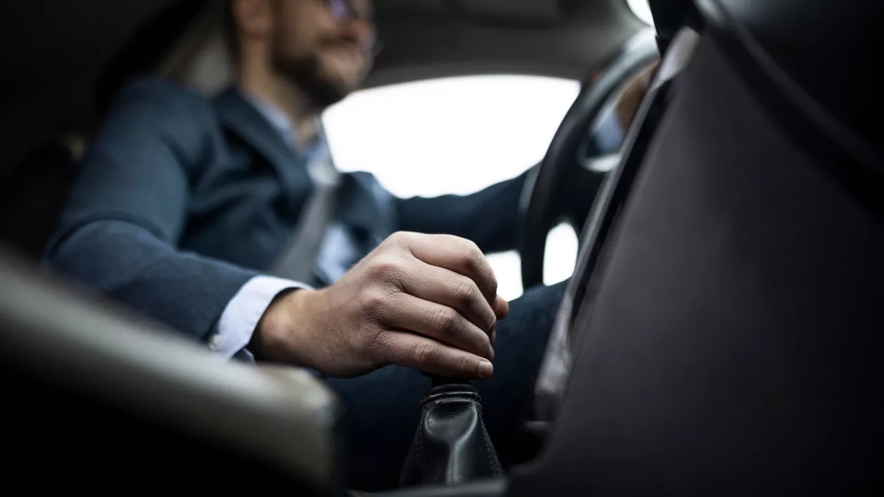 businessman-driving-his-car