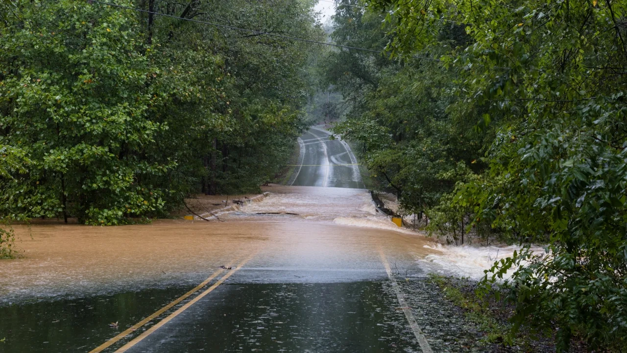 Torrential rain floods a road stock photo