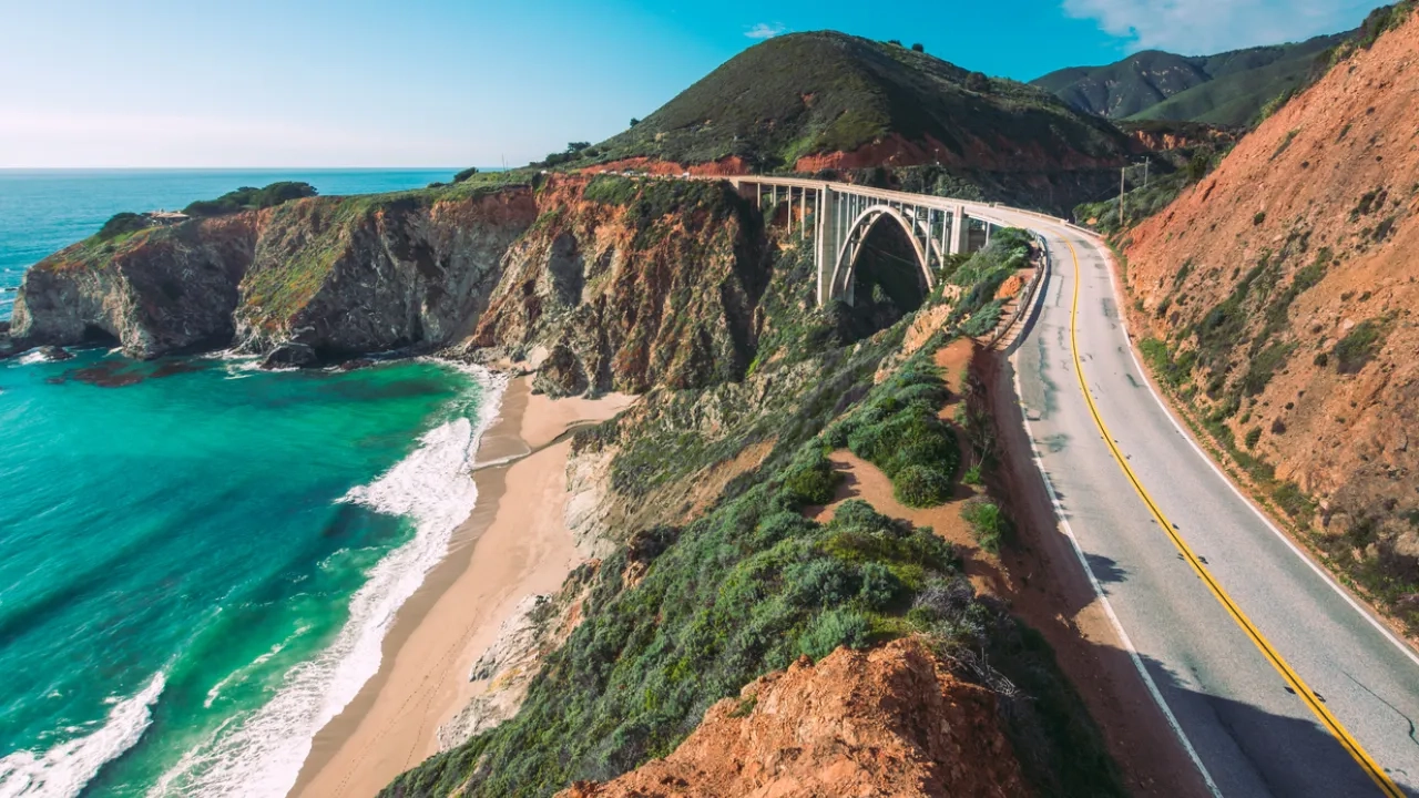 Cars drive on the Pacific Coast Highway at Big Sur in California, USA