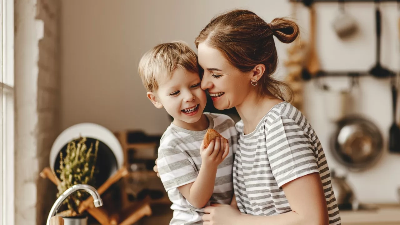 Mother and child preparing breakfast bread in the morning