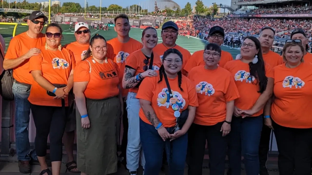 Group from TI Ontario at football game