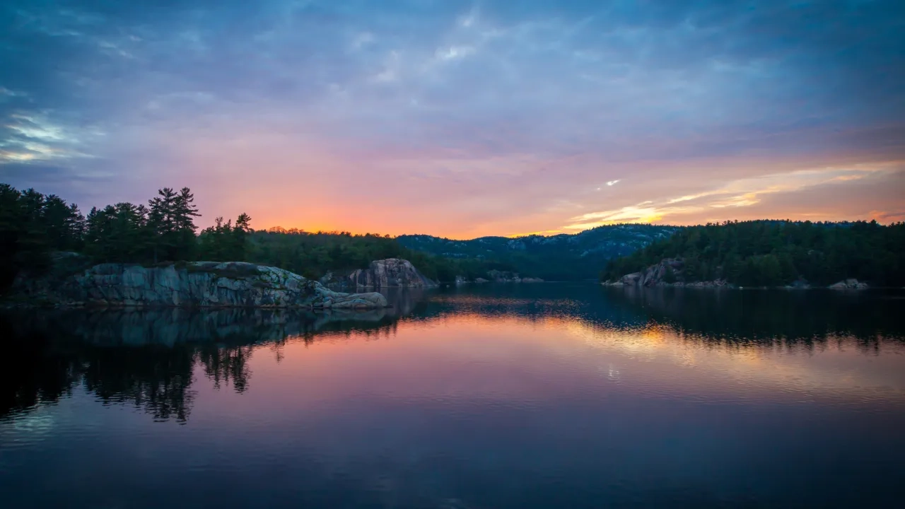 Sunset over rocky shoreline