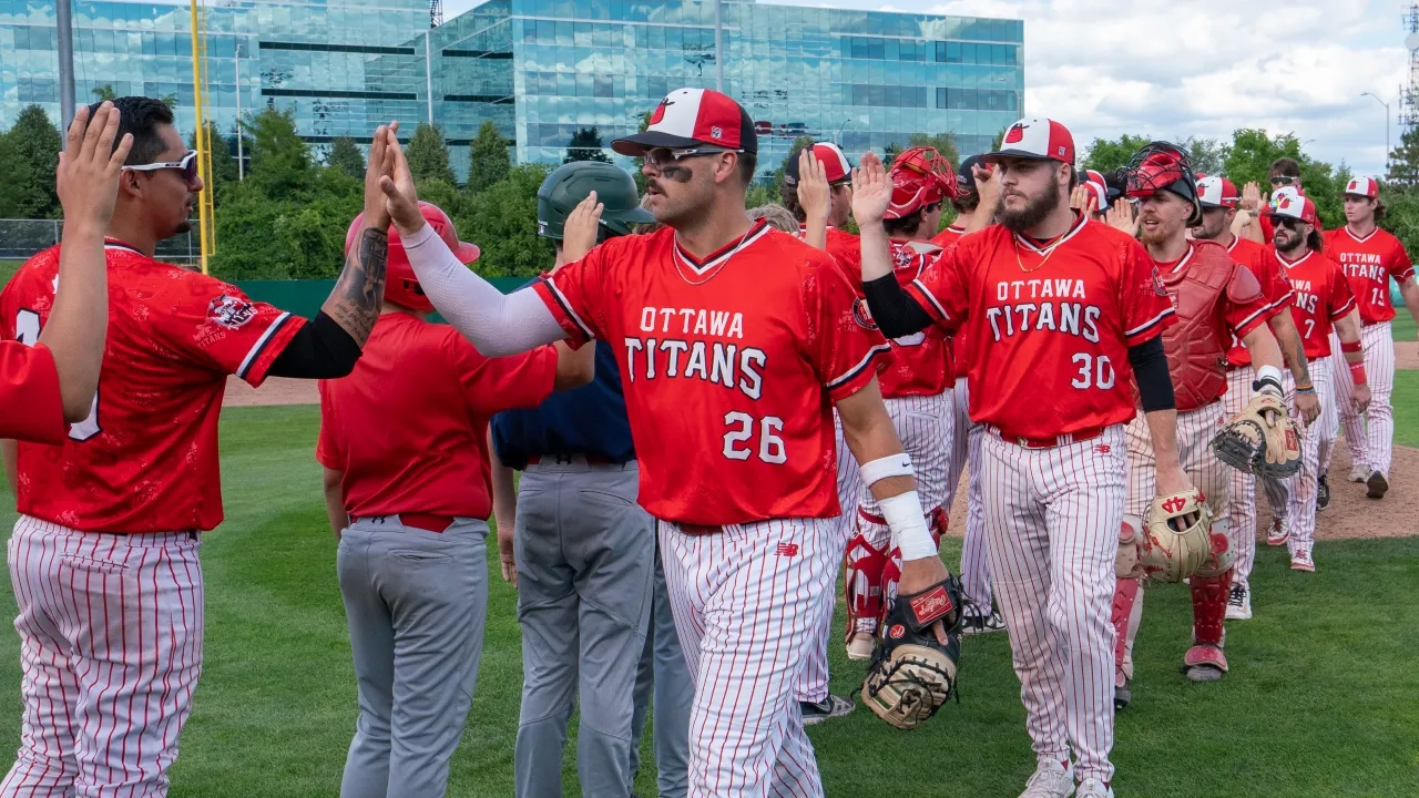 Ottawa Titans celebrating with high-fives