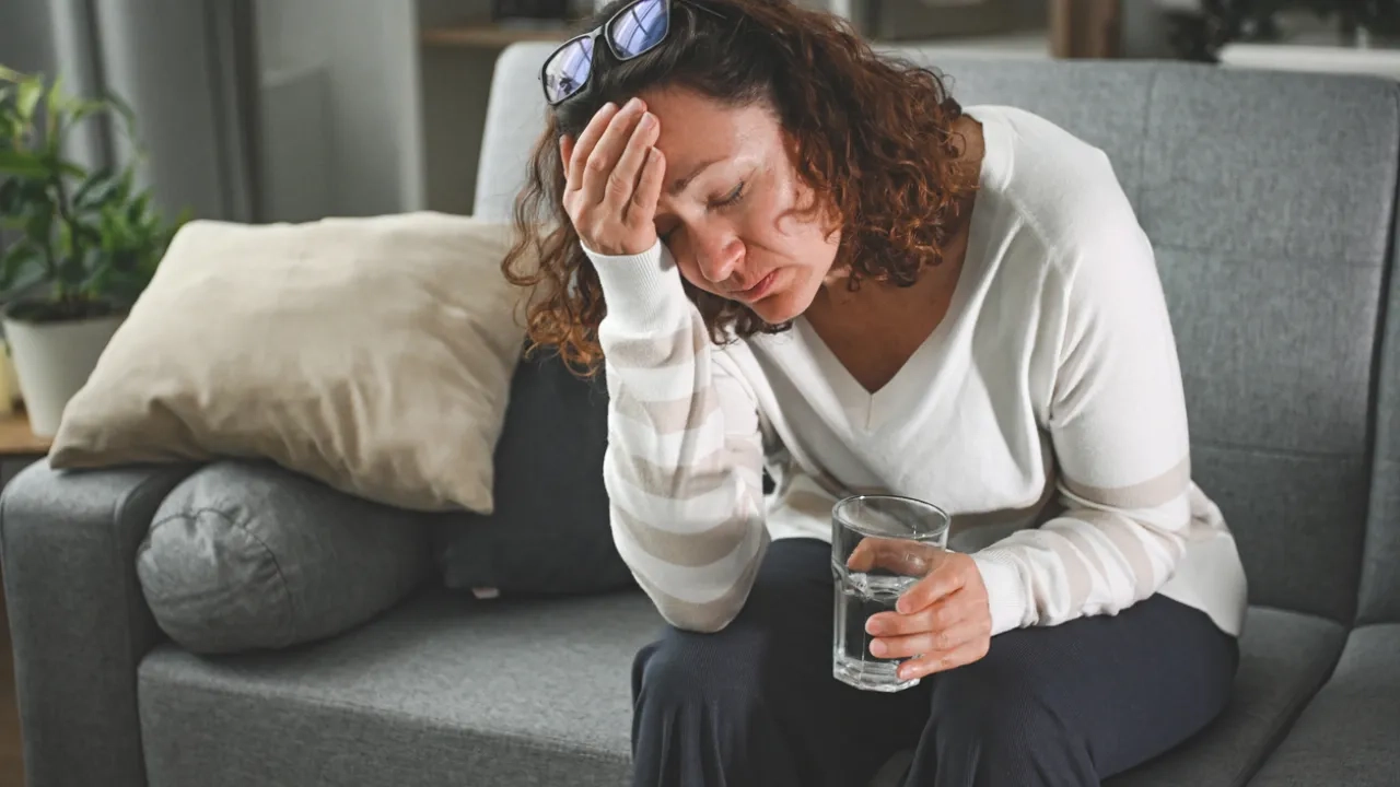 woman feeling ill from extreme heat