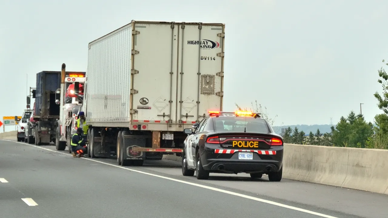 Ontario Provincial Police car pulled over on the side of the road.