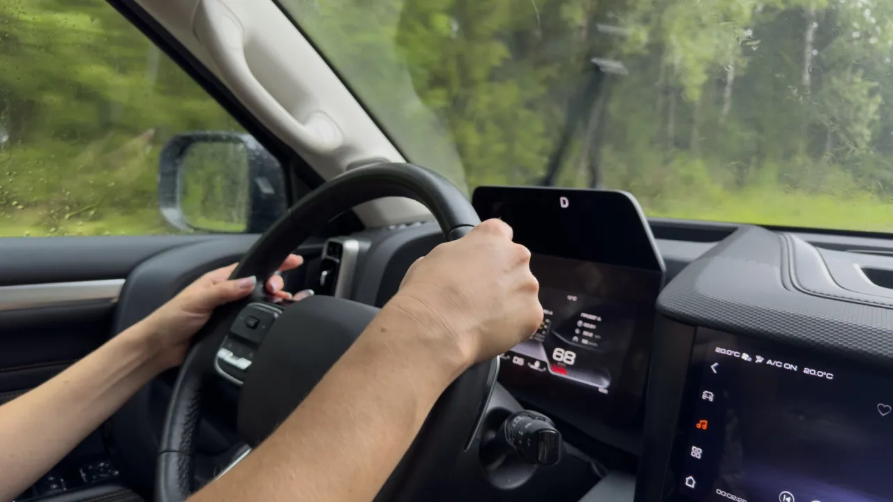 interior of car, person driving