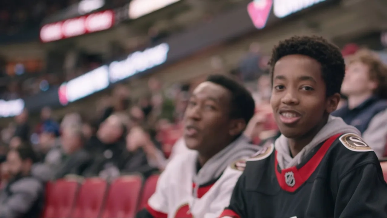 Two boys watching the Ottawa senators