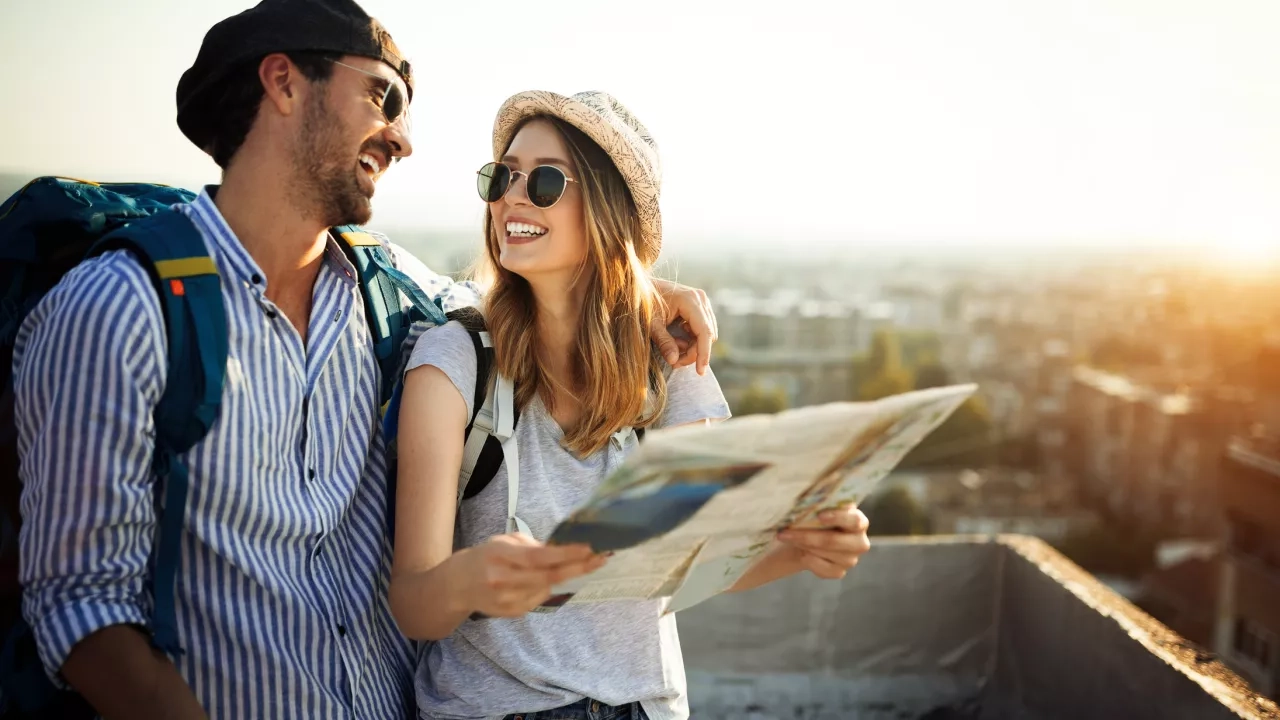 Man and woman browsing a travel map