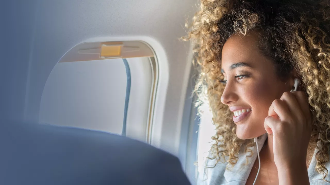 Woman happy on a plane