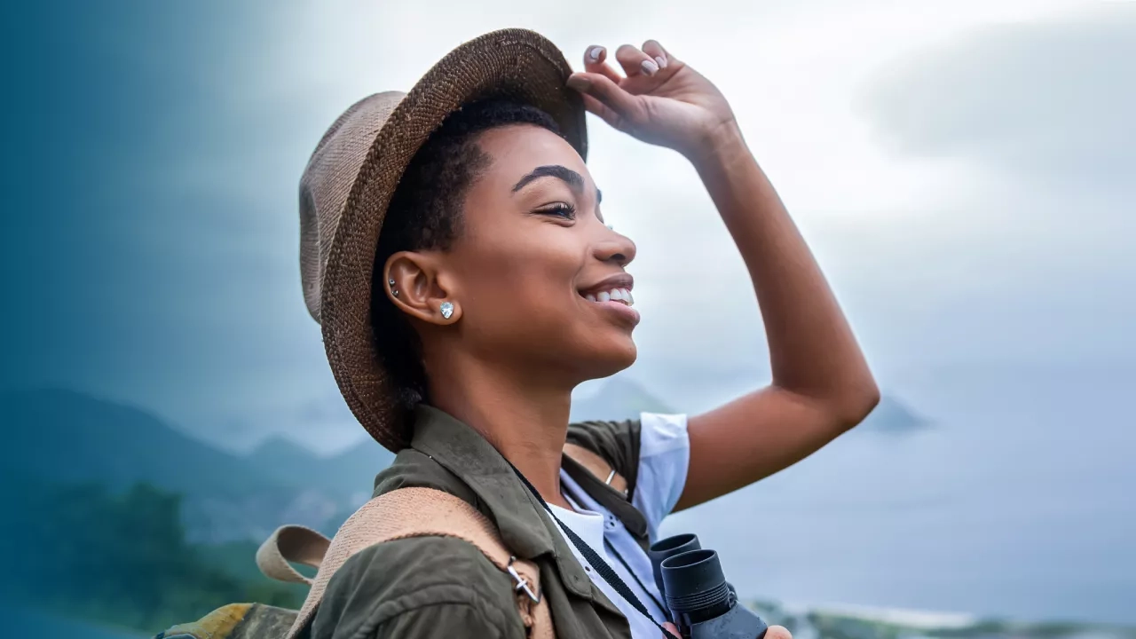 Woman with a backpack and binoculars 