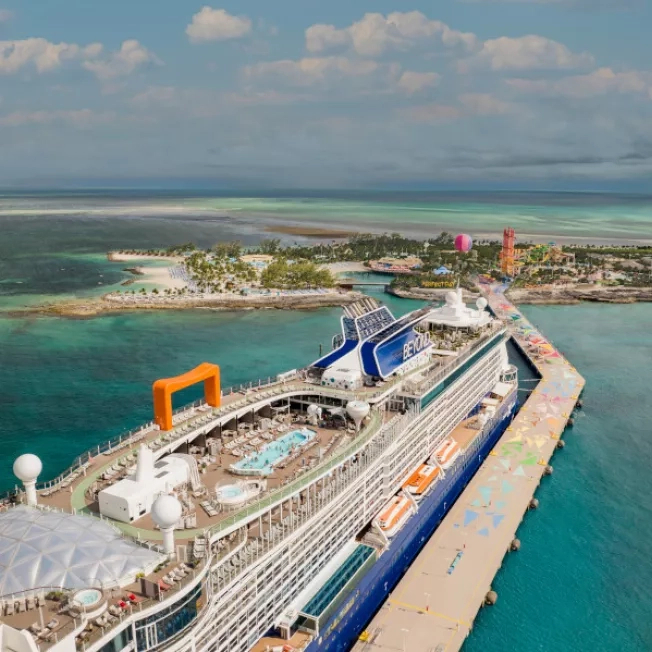 Aerial shot of a Celebrity Cruise ship docked at Perfect Day at Coco Cay