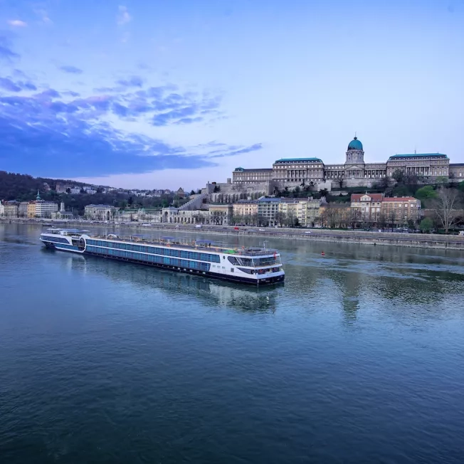 Exterior shot of Avalon Waterways' Envision ship sailing through the canal.