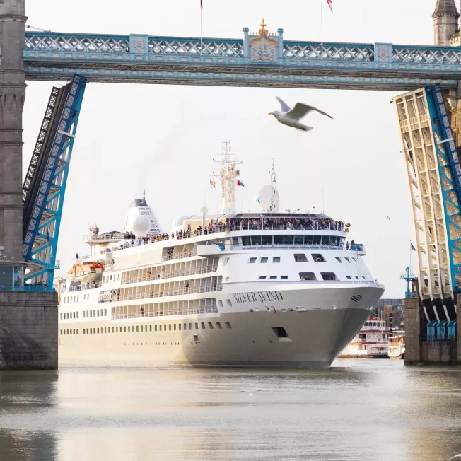 Silversea's Silver Wind ship going underneath a bridge.