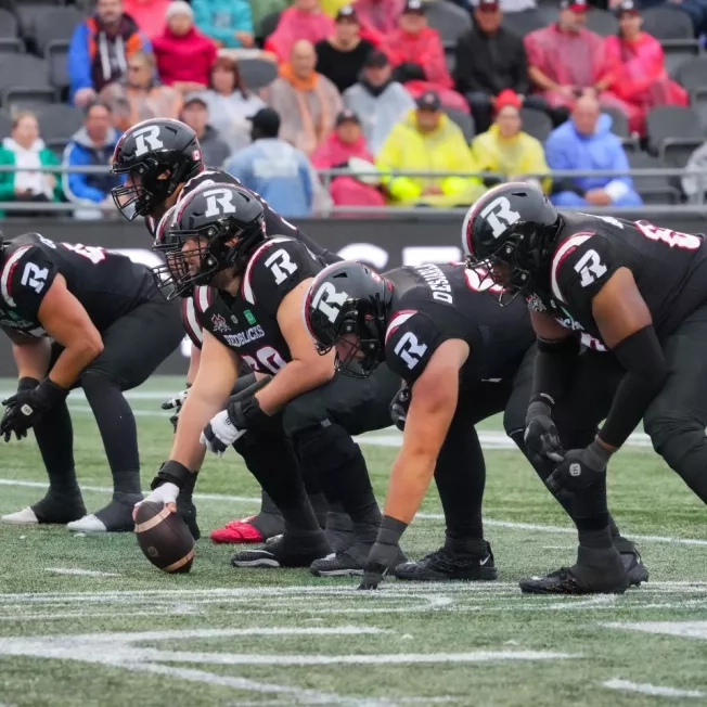 Ottawa REDBLACKS offensive line - center is about to snap the football