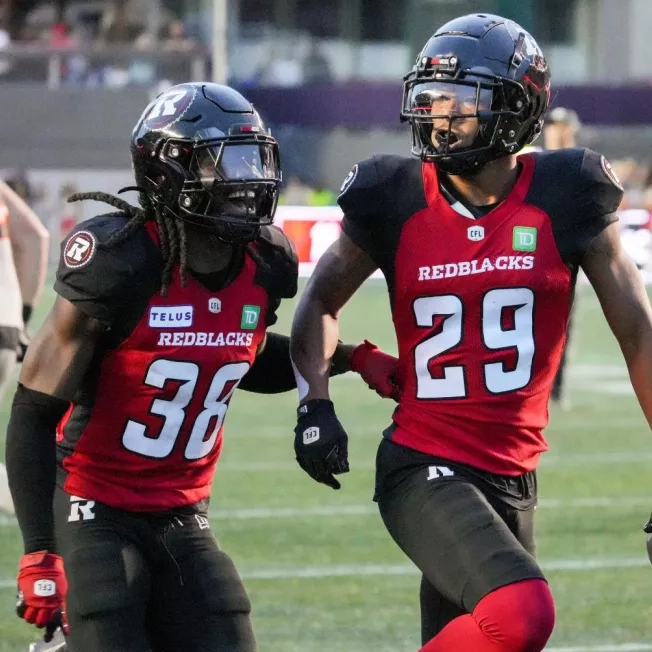 Ottawa REDBLACKS football player celebrate after making a big play