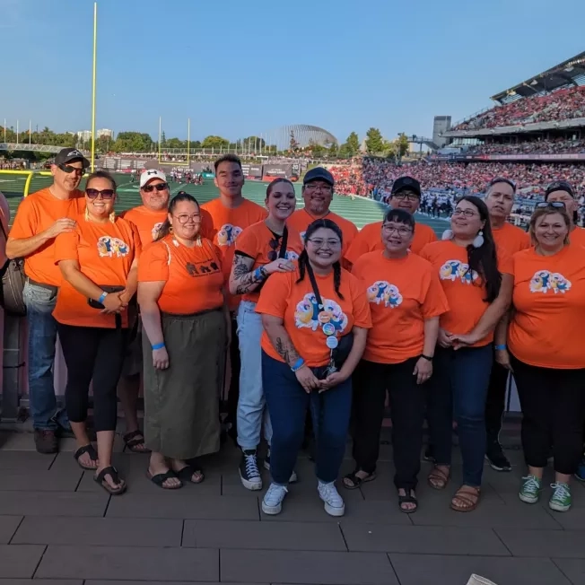 Group from TI Ontario at football game