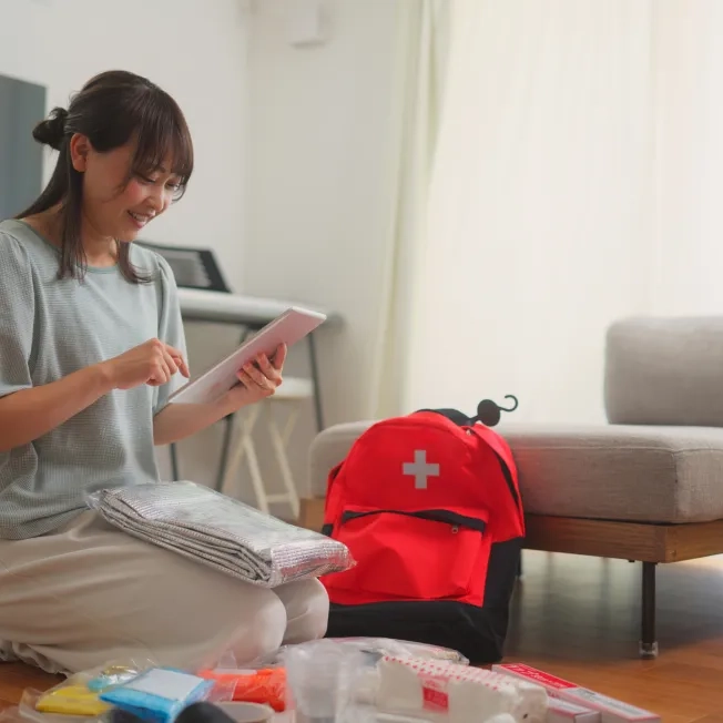 Woman preparing emergency bag