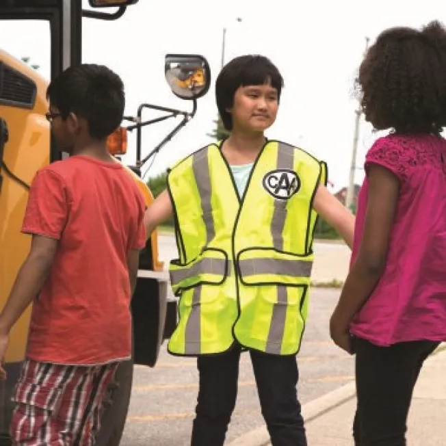 CAA Patroller helping students onto school bus