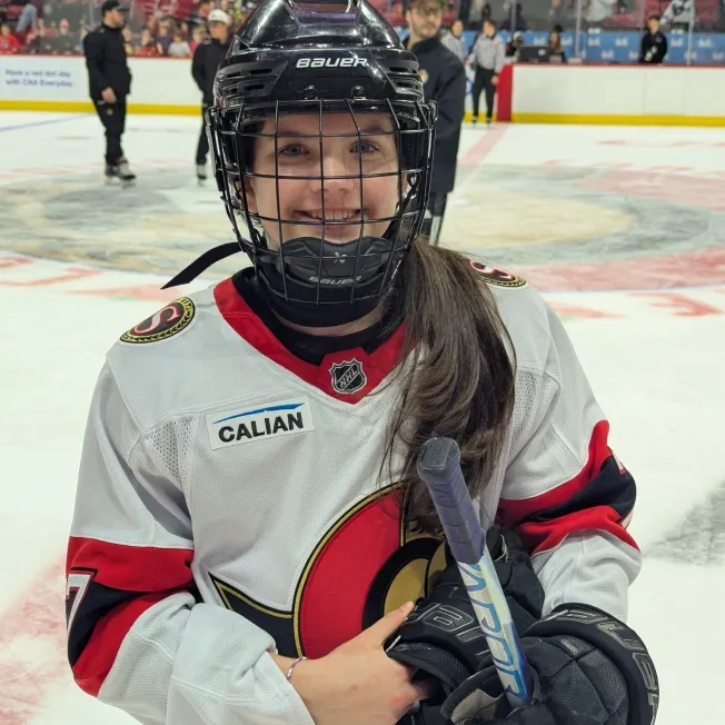Young hockey player in a senators jersey
