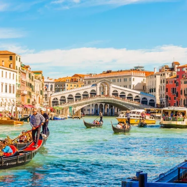 Panoramic view of the Grand Canal with gondolas and the Rialto Bridge, Venice, Italy