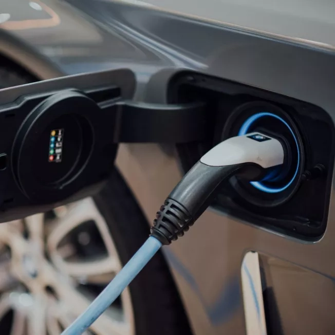 close up of a grey electric vehicle charging close up of a grey electric vehicle charging