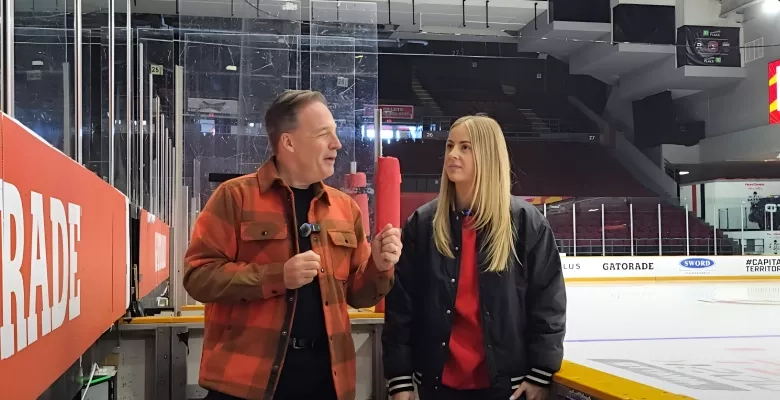 two people rink side at the TD place arena