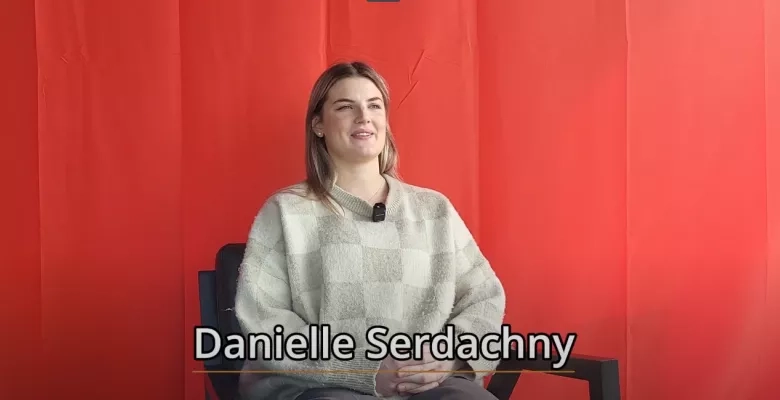 PWHL player Danielle Serdachny interviewed infront of a red background