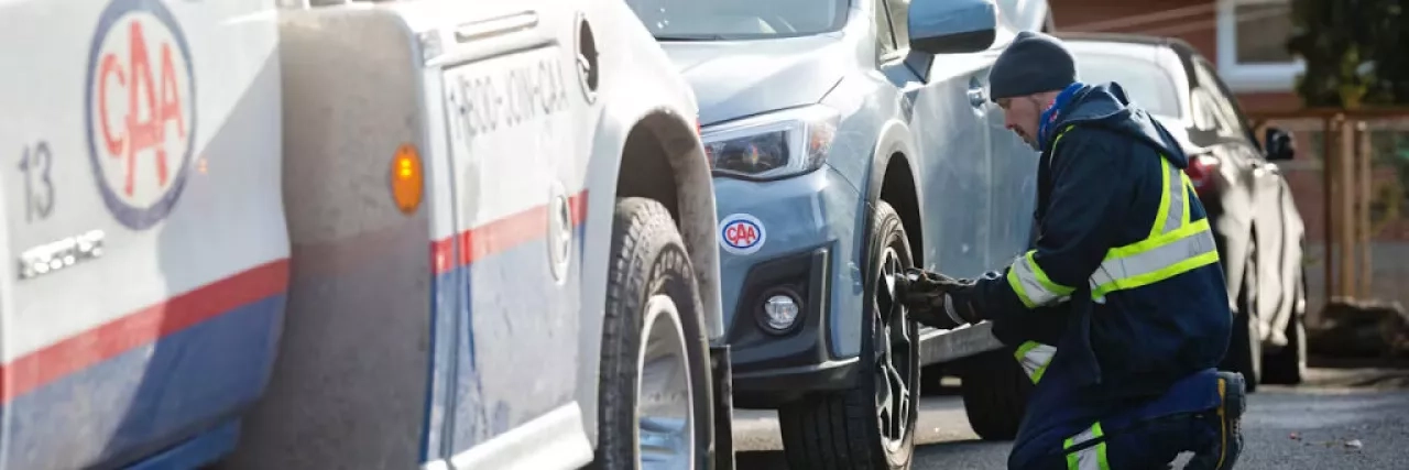 CAA driver providing roadside assistance