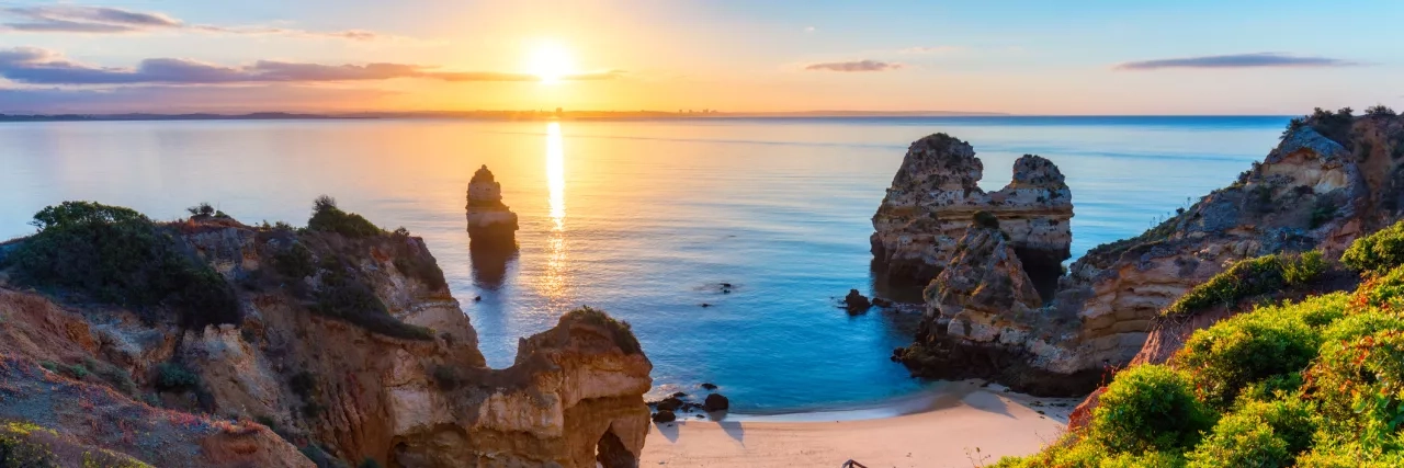 A staircase heading to the beach at sunset in the Algarve Coast, Portugal. 