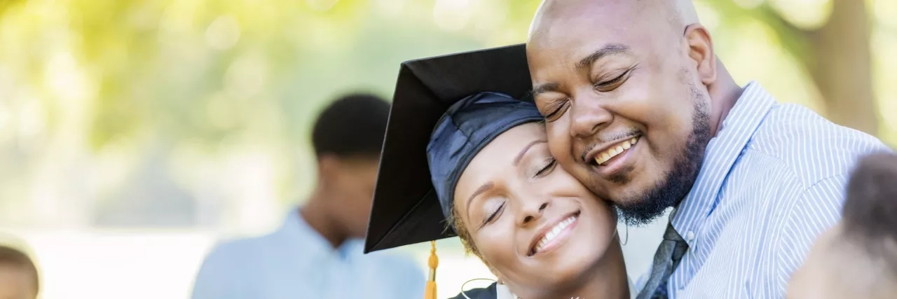 Family celebrating daughters graduation