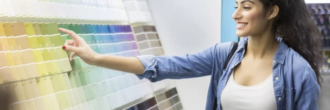 Woman choosing paint samples