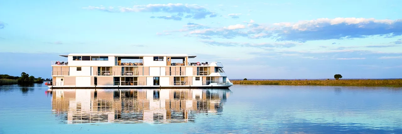 AmaWaterways' Zambezi Queen ship reflecting off the water below in Africa.