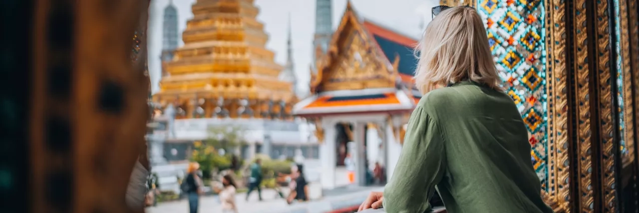 Woman admiring the view in the Golden Temple, Thailand