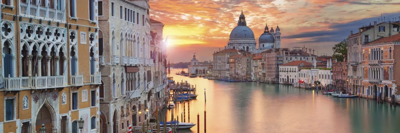 Sunset over a canal in Venice, Italy