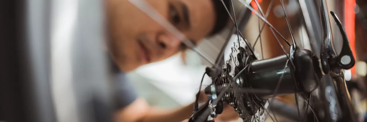 a man fixing a bike