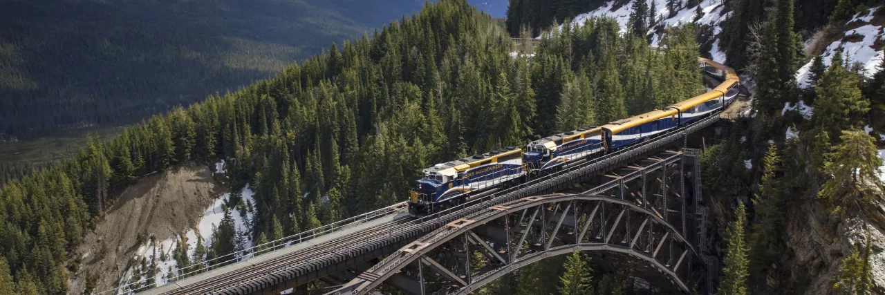 Rocky Mountaineer train going over Stoney Creek bridge in Canada