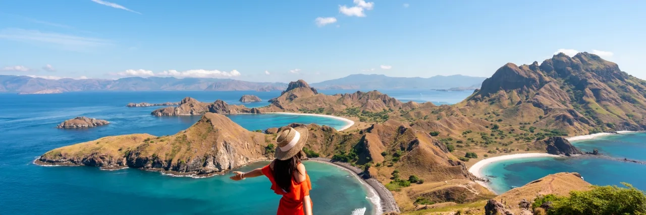tourist enjoying the landscape at Padar Island, Indonesia