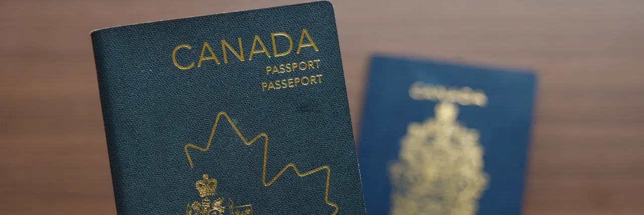 holding Canadian passport