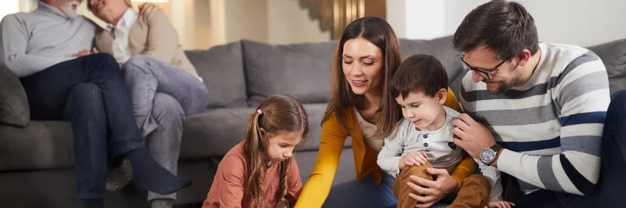 Family playing games in living room