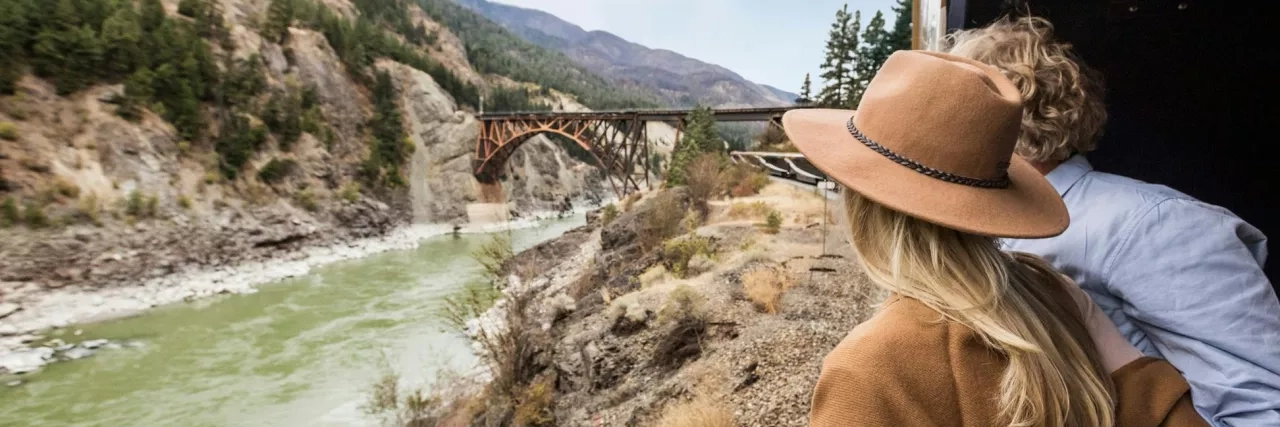 Couple looking out window on the Rocky Mountaineer