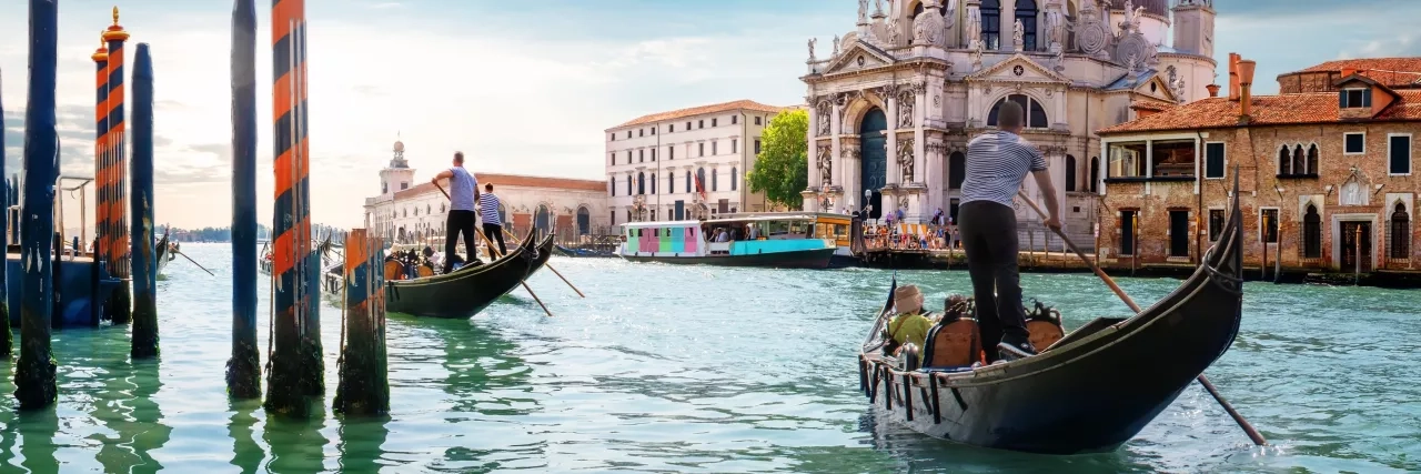 Gondolas going through Venice