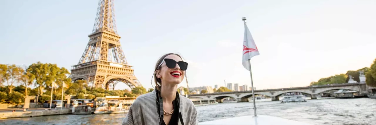 Woman enjoying landscape view on Paris city from the boat