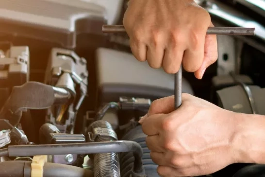 mechanic working on engine