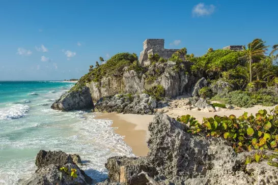 Mayan Ruins of Tulum, Mexico with sandy beach and water