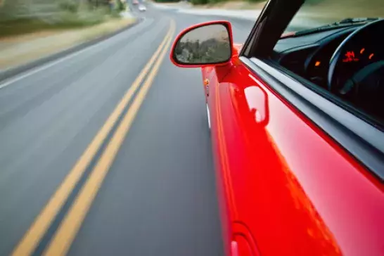 Red car driving