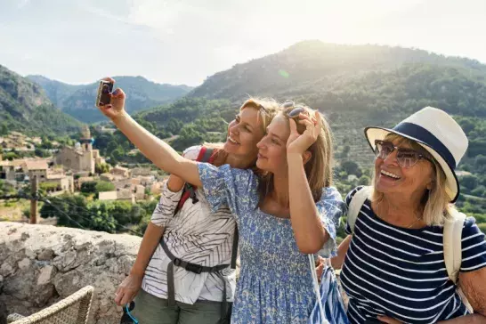 Group of women travellers taking a selfie in Italy